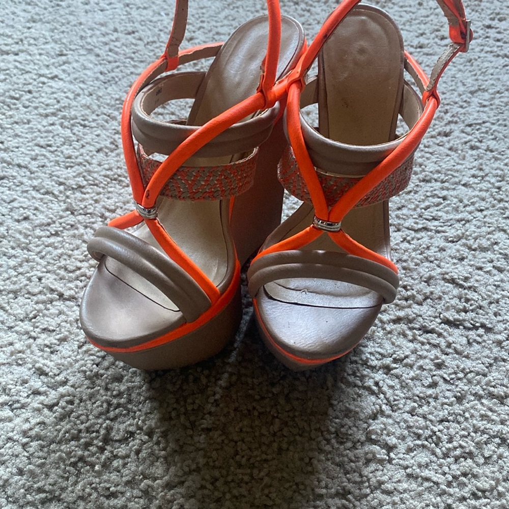 Ultra high orange and tan wedge sandals by Gwen Stefani. Gently used.